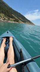 Kayaking on turquoise water on a clear summer morning