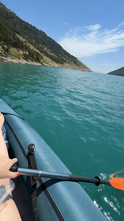 Kayaking on turquoise water on a clear summer morning