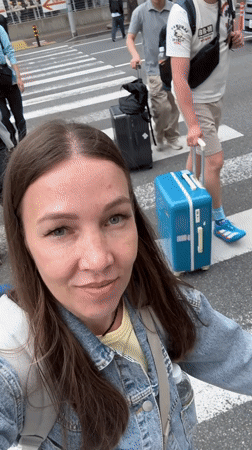 Early morning travelers with luggage spotted near Fukuoka hotel