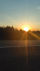 Sunset documented along roadway in Прикамский, Russia