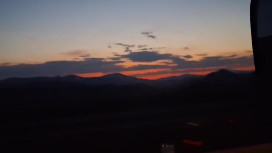 Vivid dusk sky over silhouetted mountains in rural Spain