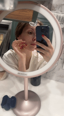 Woman conducts evening skincare routine in Tomilino, Russia