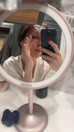 Woman conducts evening skincare routine in Tomilino, Russia