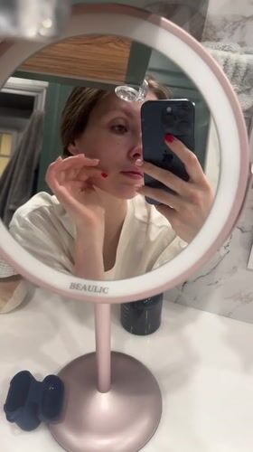 Woman conducts evening skincare routine in Tomilino, Russia