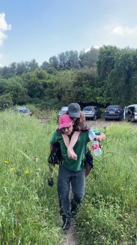 Man gives woman piggyback ride in Israeli regional council