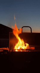 Family barbecue gathering documented at dusk in Эстачи, Russia