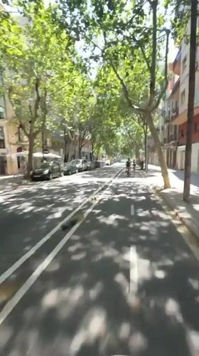 Casual cycling and scootering through sunny Barcelona streets and beachfront