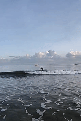Person enjoys sunset beach moment in Kuta Selatan