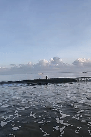 Person enjoys sunset beach moment in Kuta Selatan