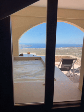Santorini terrace and pool with sweeping coastal views