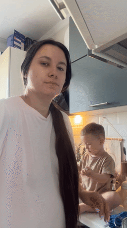 Mother and child share kitchen moment in Odintsovo