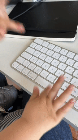 Baby plays with computer keyboard in Erba, Italy