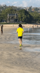 Early morning beach activities in Kuta: jogger, boat launches