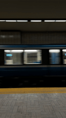 Subway train speeds through underground Montreal station