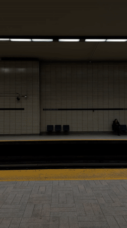 Subway train speeds through underground Montreal station