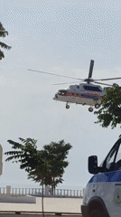 Military and emergency helicopters circle over Aktau's waterfront plaza