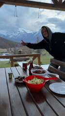 Friends gather for mountain-view barbecue meal in Montenegro
