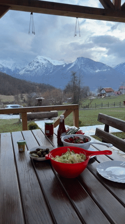 Friends gather for mountain-view barbecue meal in Montenegro