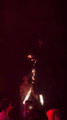 Fire performer entertains under moonlit evening in Luštica, Montenegro