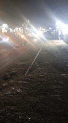 Nighttime street scene at a Bukittinggi roadside market