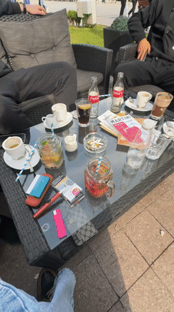 Three men gather at outdoor cafe in Ruse, Bulgaria