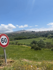 Motorcyclist travels through scenic Moroccan countryside, stops for fuel