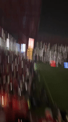 Soccer fans create light display with phones at Toluca stadium