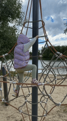 Child plays at lakeside playground in Malakhovka, Russia