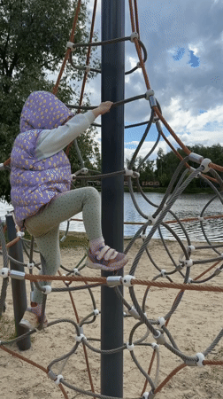 Child plays at lakeside playground in Malakhovka, Russia