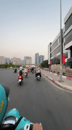 Scooter rider captures street scene in Thủ Đức, Vietnam
