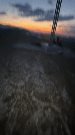 Sunset illuminates hilltop cross in Sinitovo, Bulgaria