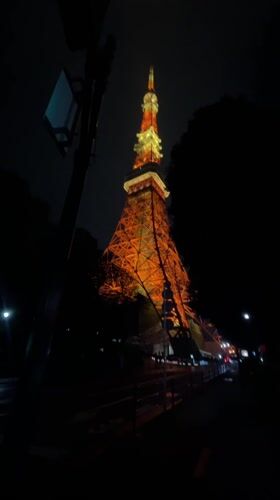Tokyo Tower captured illuminated in orange and white at night