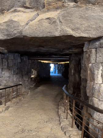 Tourist documents volcanic architecture venues across San Bartolomé, Spain