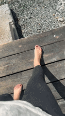 Person relaxes on wooden deck in sunny Kharnavy morning