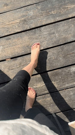 Person relaxes on wooden deck in sunny Kharnavy morning