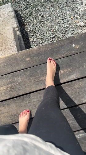 Person relaxes on wooden deck in sunny Kharnavy morning