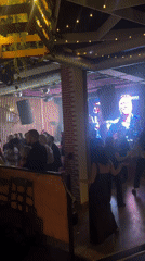 Nightclub crowd dancing under disco lights in Ulan-Ude