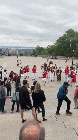 Brass band performs at Montreal's Mount Royal, crowds dance