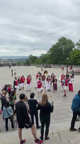 Brass band performs at Montreal's Mount Royal, crowds dance