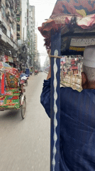 Rickshaw ride captured on video in busy Dhaka street