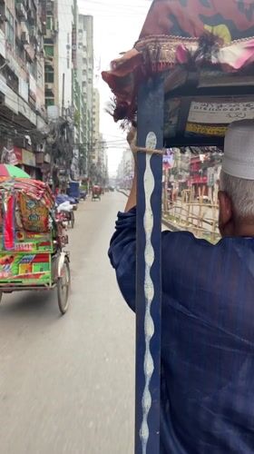 Rickshaw ride captured on video in busy Dhaka street