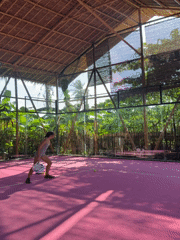 Woman plays padel on pink court in General Luna