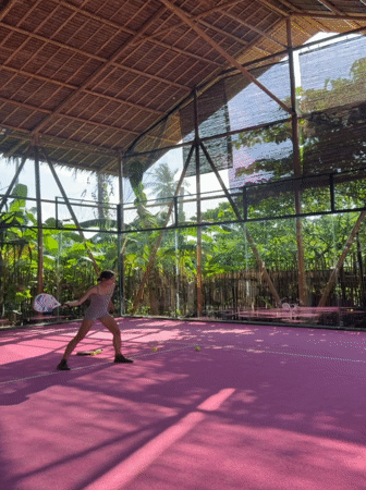 Woman plays padel on pink court in General Luna