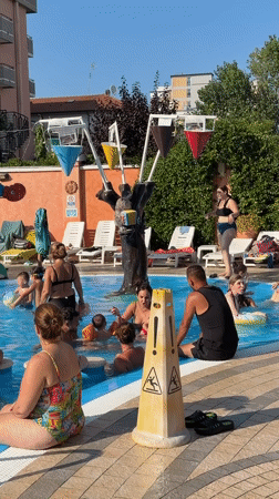 Crowded summer pool day in Gatteo, Italy
