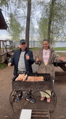 Couple dances while barbecuing in Chaikovsky, Russia