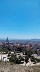 Clear skies frame Barcelona's sprawling cityscape in morning footage