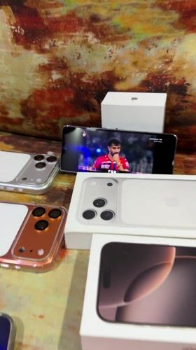 Multiple iPhones displayed at Shahapur residence with children, dog present