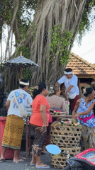 Traditional Balinese ceremony with offerings observed in Nusa Dua