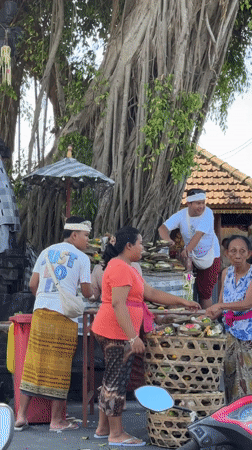 Traditional Balinese ceremony with offerings observed in Nusa Dua