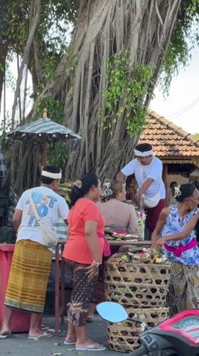 Traditional Balinese ceremony with offerings observed in Nusa Dua